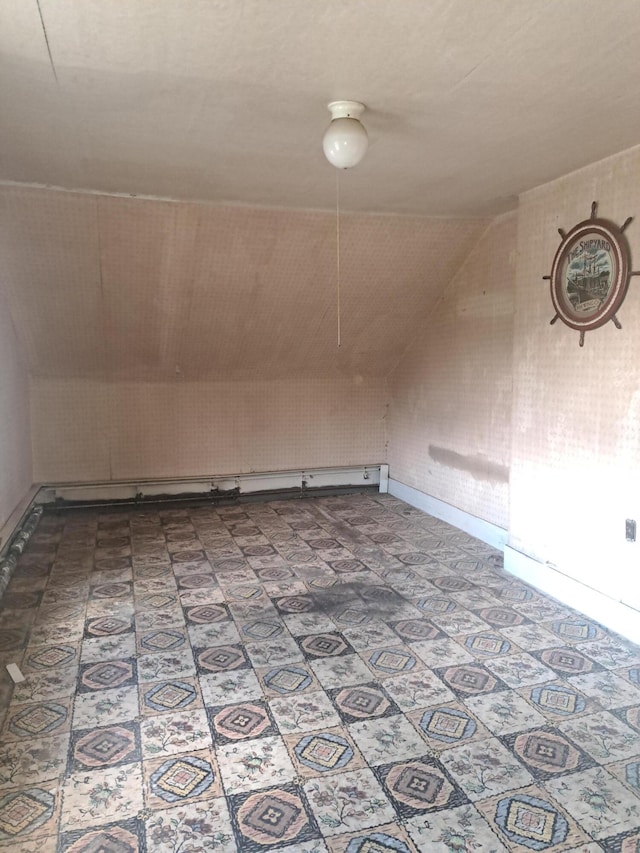 bonus room featuring vaulted ceiling