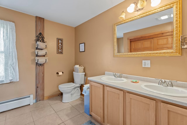 bathroom featuring a baseboard radiator, toilet, vanity, and tile patterned flooring