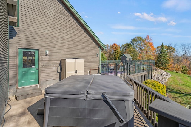 view of side of property with a hot tub