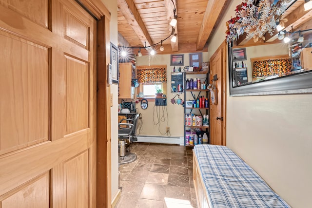 interior space with wood ceiling, beam ceiling, and a baseboard heating unit