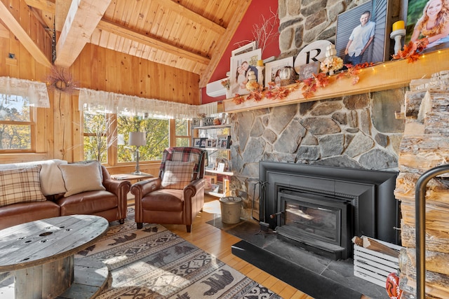 living room with hardwood / wood-style floors, beamed ceiling, high vaulted ceiling, and wooden ceiling