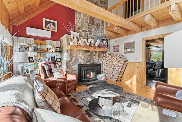 living room with an AC wall unit, a high ceiling, hardwood / wood-style floors, wood walls, and wooden ceiling