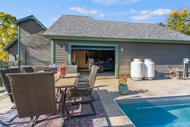 view of patio / terrace featuring a garage