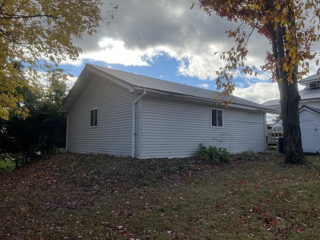 37 Spruce St, East Millinocket, ME 04430 - view of property exterior with a metal roof