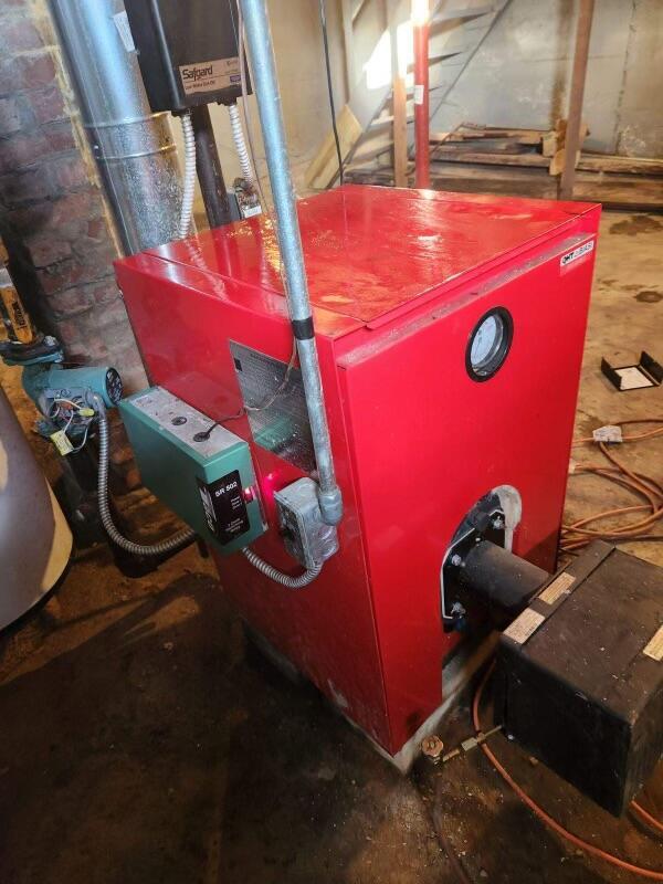 37 Spruce St, East Millinocket, ME 04430 - utility room featuring a heating unit