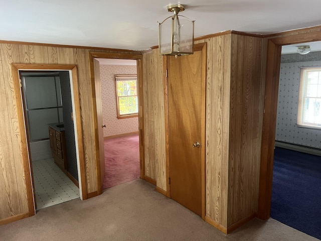 37 Spruce St, East Millinocket, ME 04430 - corridor featuring carpet floors, plenty of natural light, wallpapered walls, and a baseboard radiator