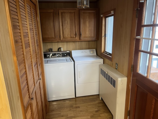 37 Spruce St, East Millinocket, ME 04430 - washroom featuring radiator heating unit, washing machine and clothes dryer, cabinet space, and plenty of natural light