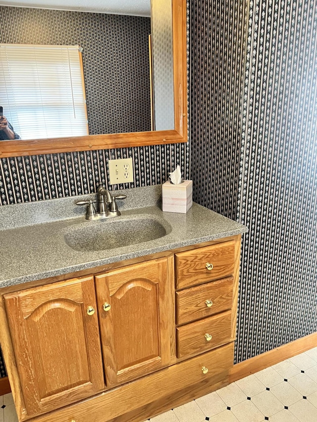 37 Spruce St, East Millinocket, ME 04430 - bathroom with vanity and tile patterned floors