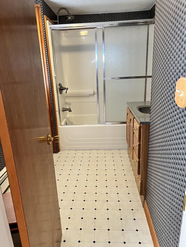 37 Spruce St, East Millinocket, ME 04430 - full bathroom featuring tile patterned floors, combined bath / shower with glass door, and vanity