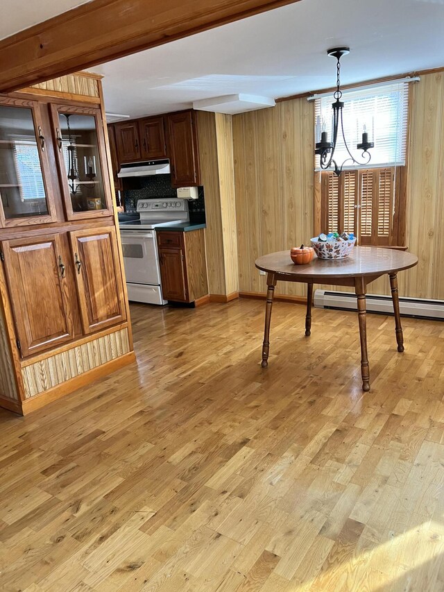 37 Spruce St, East Millinocket, ME 04430 - kitchen featuring white electric range oven, under cabinet range hood, light wood-style flooring, a chandelier, and wood walls