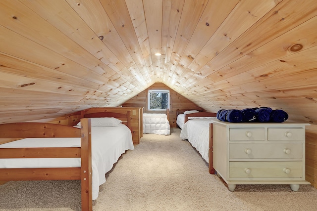 carpeted bedroom with wooden walls, vaulted ceiling, and wooden ceiling