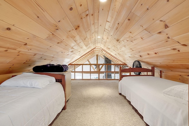 carpeted bedroom featuring wood ceiling and vaulted ceiling