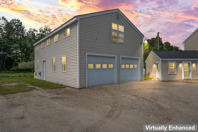 property exterior at dusk with a garage