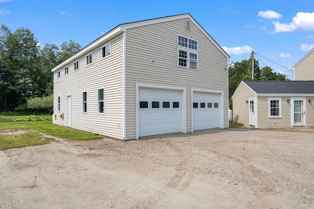 view of property exterior with a garage