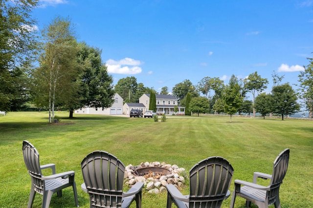 view of yard with a fire pit