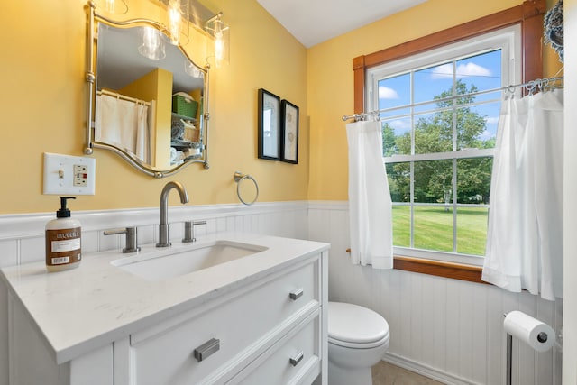 bathroom featuring tile patterned floors, toilet, and vanity