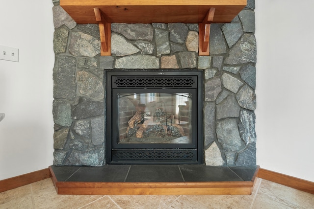 details featuring a stone fireplace