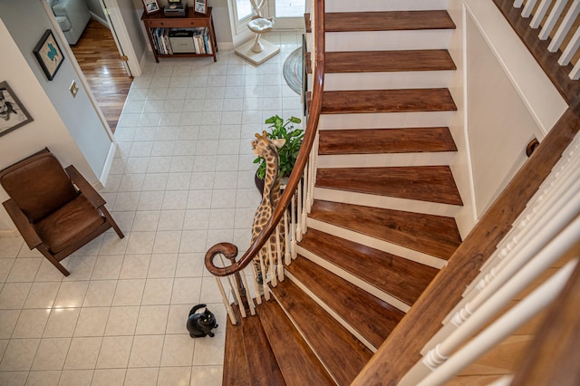 stairs with tile patterned floors