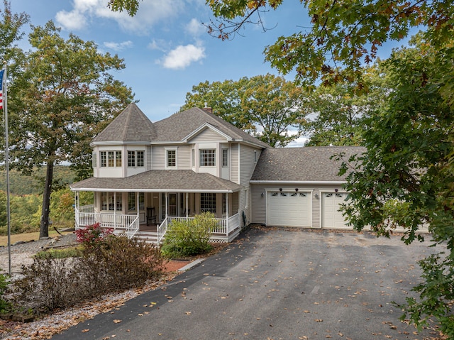 view of front of home featuring a garage and covered porch