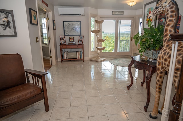 sitting room with light tile patterned floors and a wall unit AC