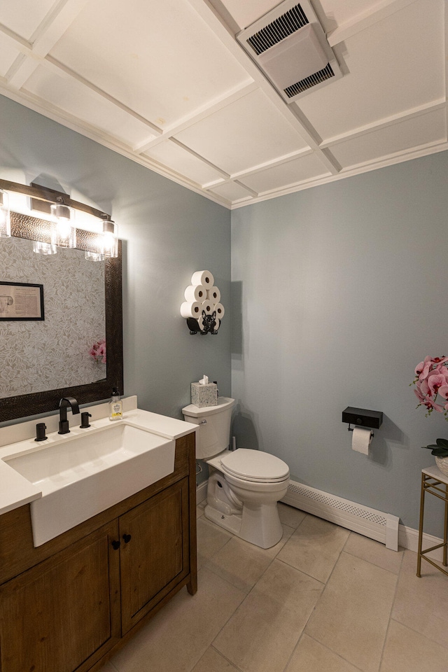 bathroom with vanity, baseboard heating, tile patterned flooring, and toilet