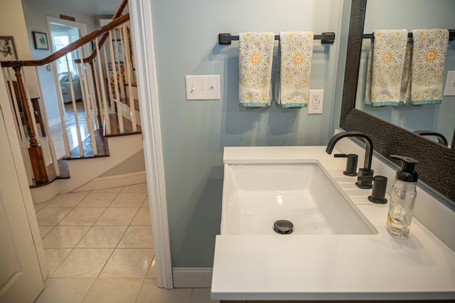 bathroom featuring tile patterned flooring and vanity