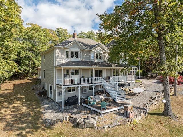 back of property featuring covered porch