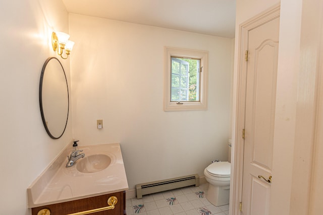 bathroom with vanity, baseboard heating, toilet, and tile patterned floors