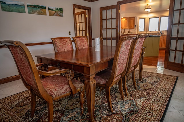 dining room with sink and light tile patterned floors