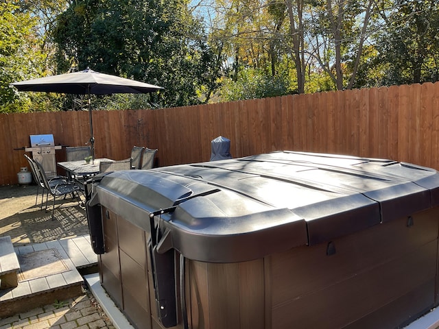 view of patio featuring a hot tub