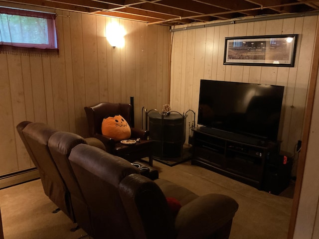 carpeted living room with wooden walls and a baseboard heating unit