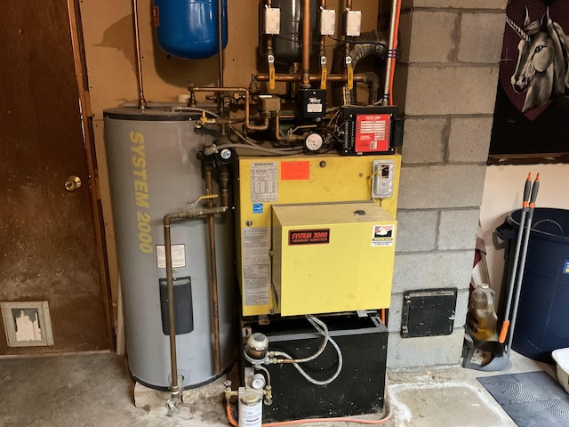 utility room featuring water heater