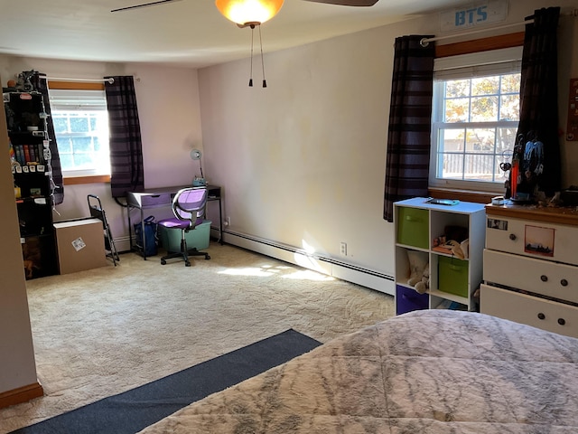 bedroom featuring a baseboard heating unit, carpet, and ceiling fan