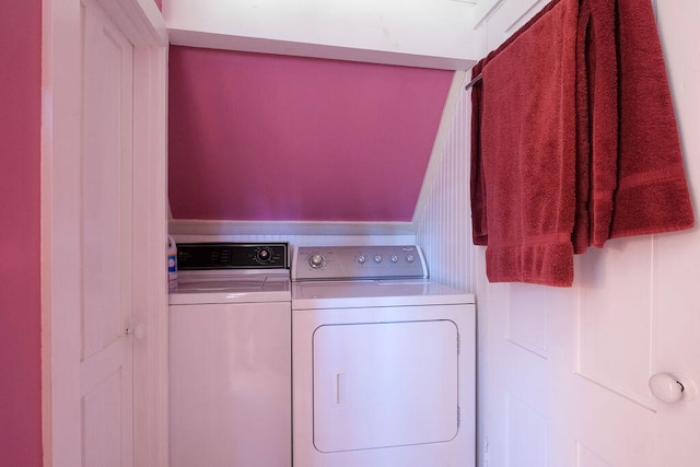 clothes washing area featuring independent washer and dryer