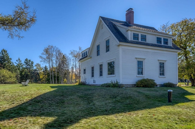 view of home's exterior featuring a lawn