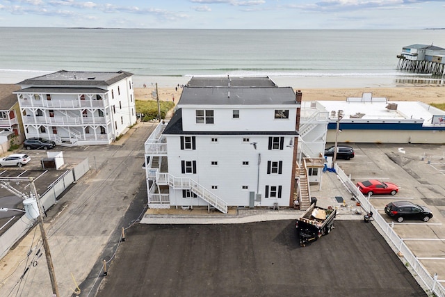 aerial view with a water view and a view of the beach