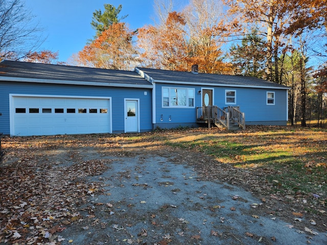 single story home with a garage