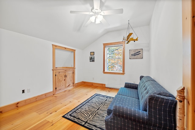 living room with a baseboard radiator, ceiling fan, wood-type flooring, and vaulted ceiling