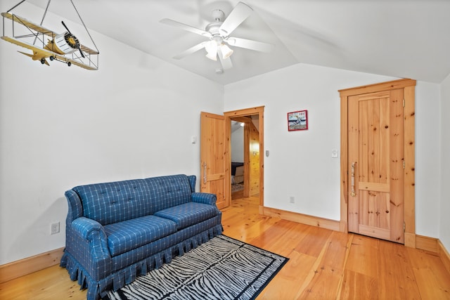 sitting room with lofted ceiling, hardwood / wood-style floors, and ceiling fan