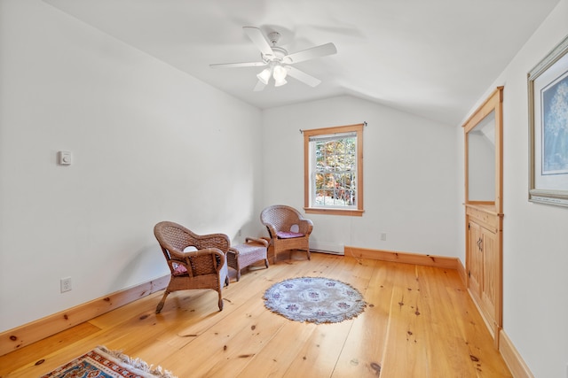 sitting room featuring vaulted ceiling, light hardwood / wood-style floors, and ceiling fan