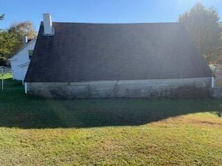 view of home's exterior featuring a yard