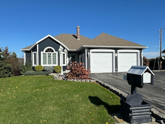 ranch-style house with a garage and a front lawn