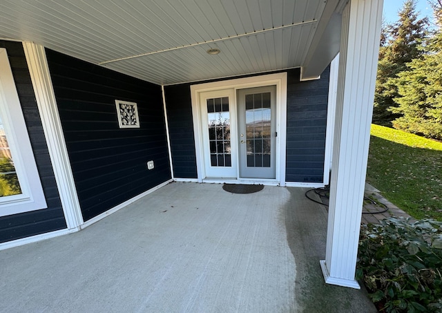 property entrance with a patio area