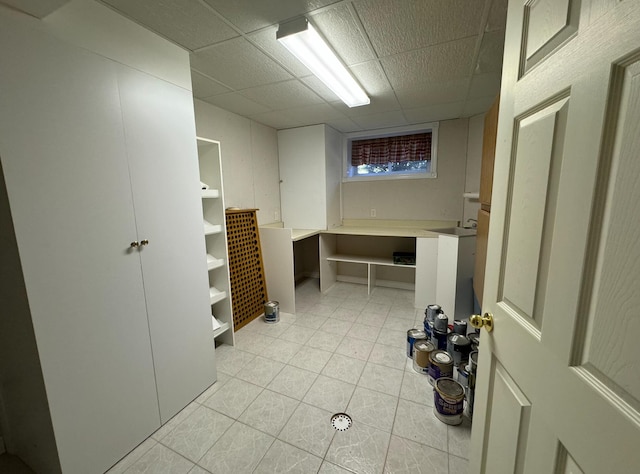 laundry area featuring light tile patterned flooring