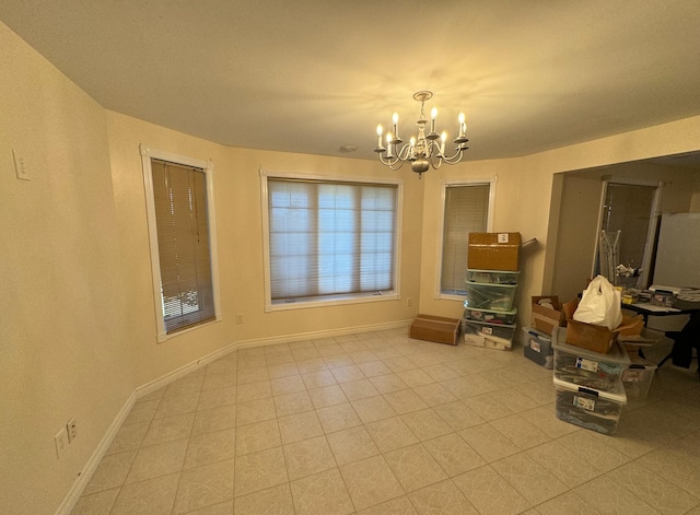 tiled dining area with a notable chandelier