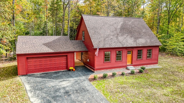 view of front of home featuring a garage and a front yard