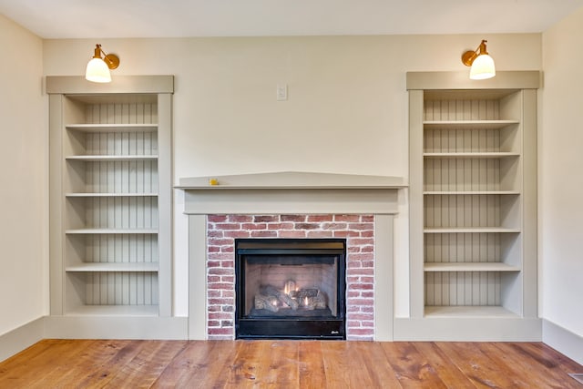 unfurnished living room with wood-type flooring