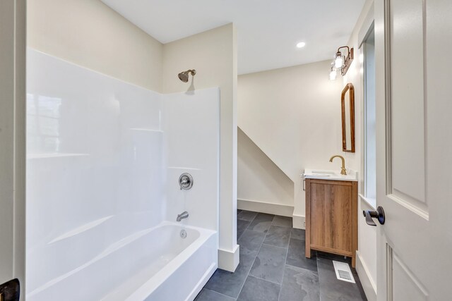 bathroom with vanity and shower / tub combination