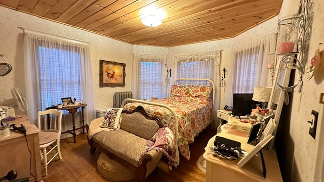 bedroom featuring wood ceiling and hardwood / wood-style flooring