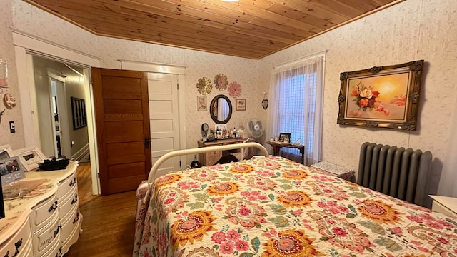 bedroom featuring dark wood-type flooring, wood ceiling, and radiator